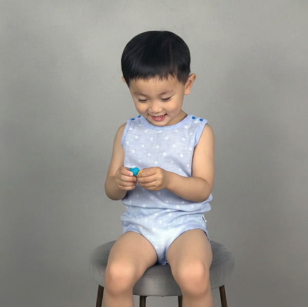 pokka kids baby blue eczema safe bodysuit worn by toddler boy playing