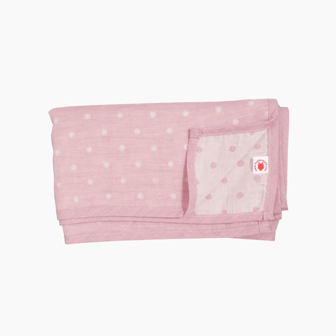 Folded pink GOTS certified organic cotton blanket in Versatile size for use as a stroller cover, or nursing cover