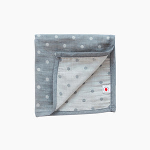 Folded gray jacquard GOTS certified organic cotton hanky for use as a  wash cloth, burp cloth, bib, scarf or security blanket