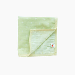Folded lime GOTS certified organic cotton hanky for use as a wash cloth, burp cloth, bib, scarf or security blanket