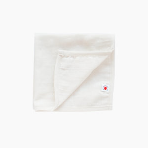 Folded dye free GOTS certified organic cotton hanky for use as a wash cloth, burp cloth, bib, scarf or security blanket